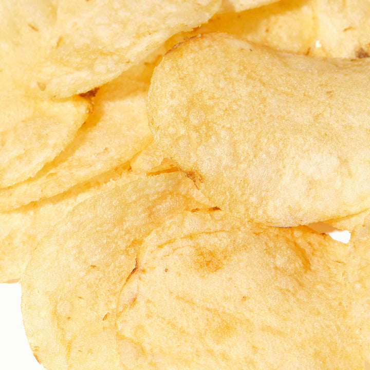 A pile of Calbee My Pote Potato Chips: Himalayan Salt on a white background.