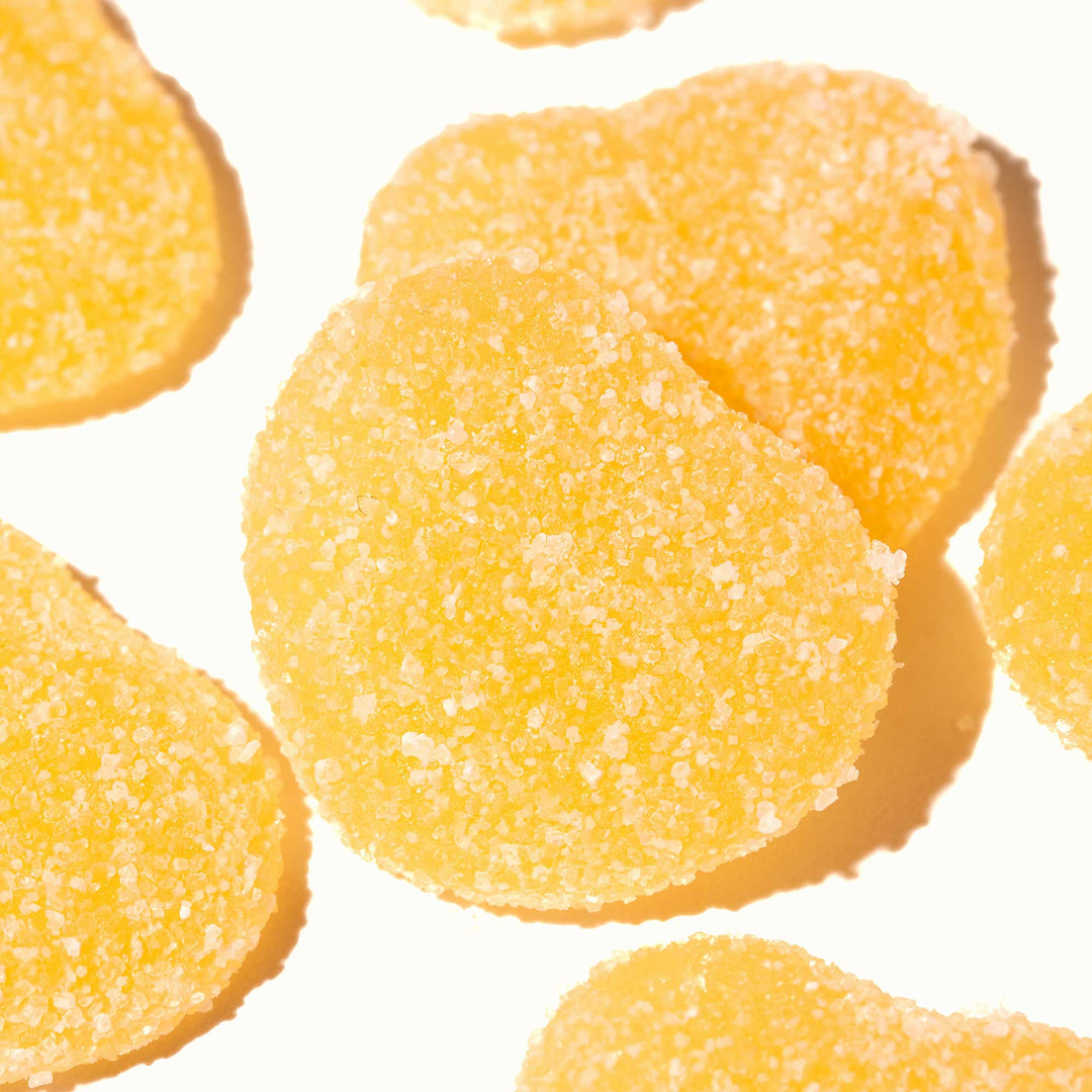 A group of Kanro Puré Gummy: Lemon candies on a white surface.