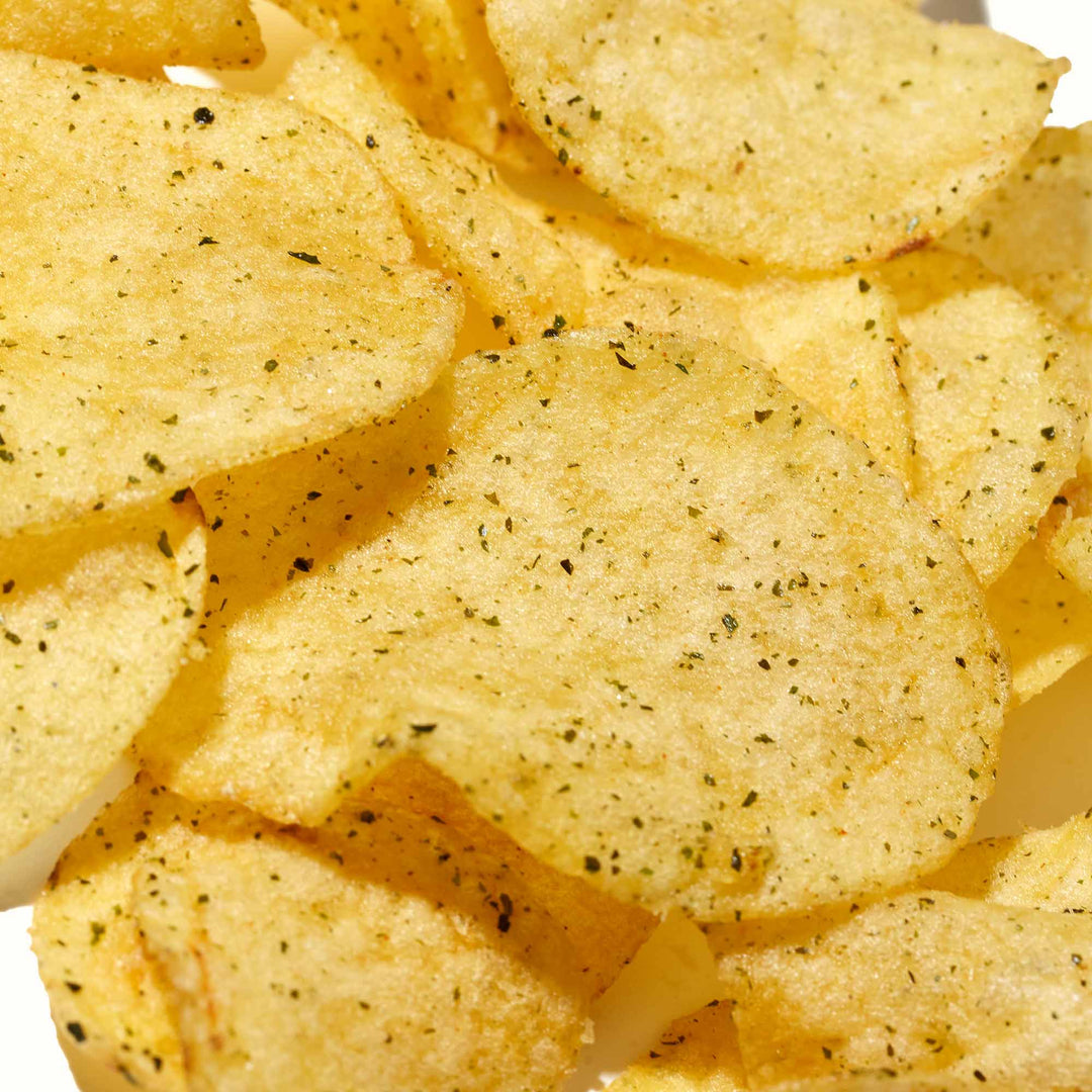 A pile of Calbee Potato Chips: Seaweed & Salt on a white background.