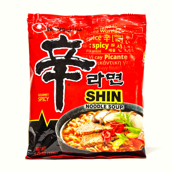 A bag of Nongshim Shin Ramyun Spicy Ramen on a white background.