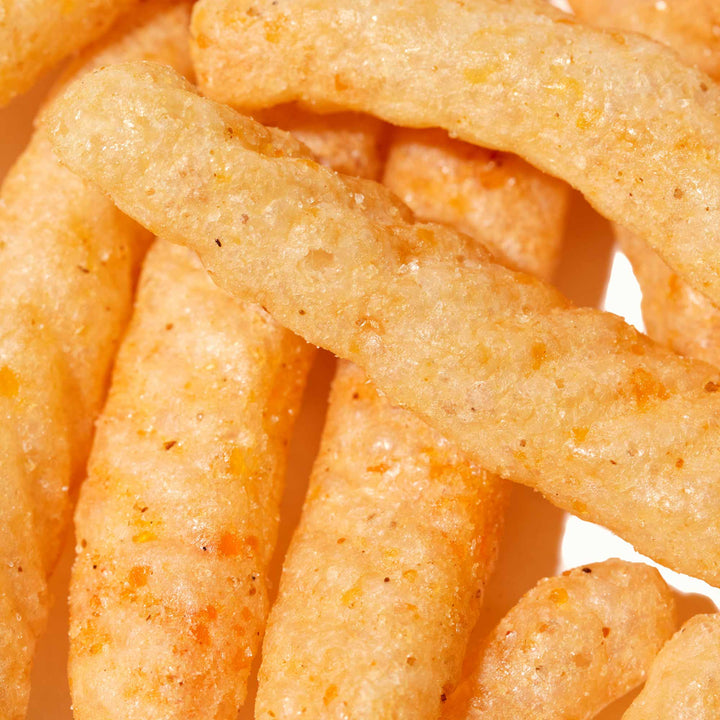 A close up image of a pile of Calbee Shrimp Chips: Hot Garlic.