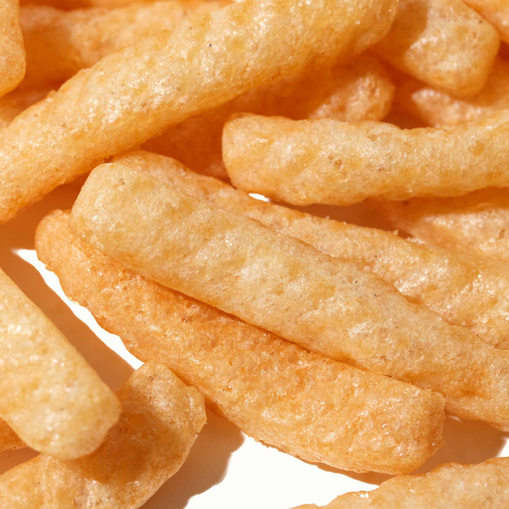 A pile of Calbee Shrimp Chips: Original on a white background.