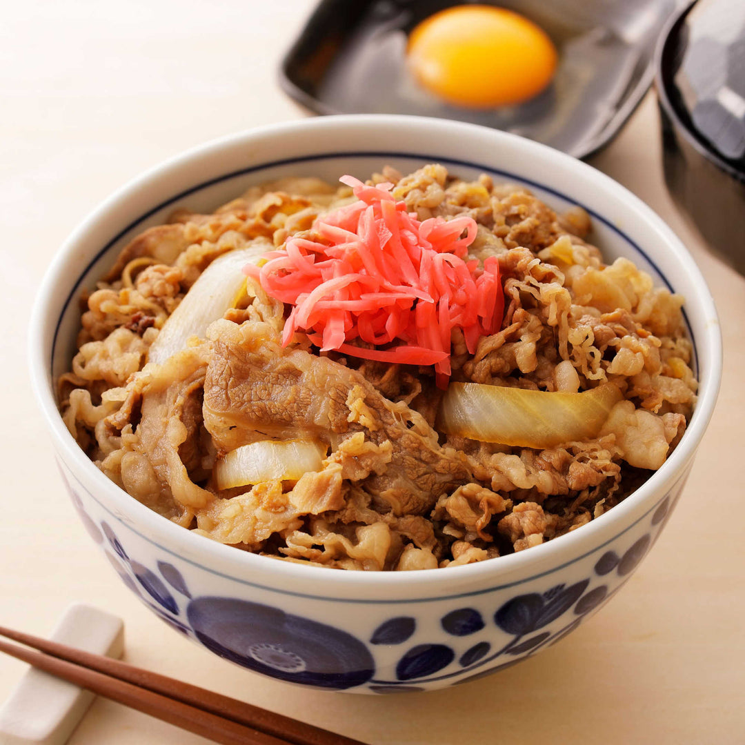 A bowl of Yoshinoya Gyudon Cooked Beef with Onion from Yoshinoya.
