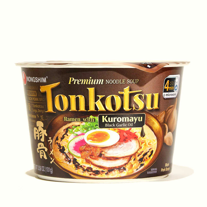 A cup of Nongshim Tonkotsu Big Bowl Ramen Noodle with Mayu Black Garlic Oil on a white background.