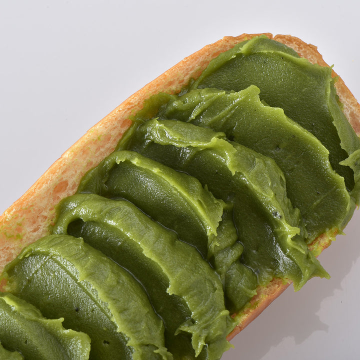 A piece of bread with Kuze Fuku Matcha Spread on it.