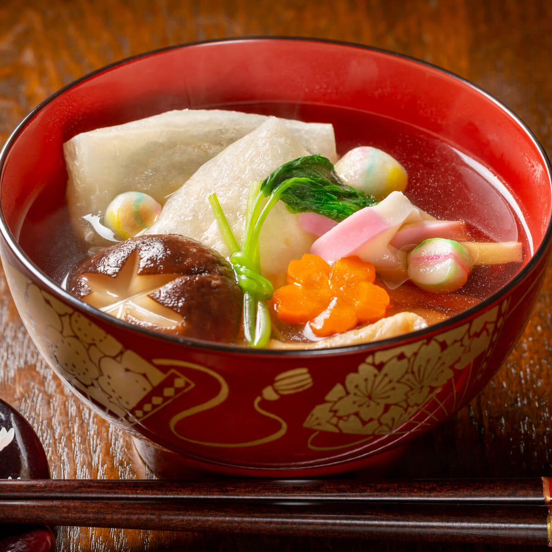 Taimatsu Shokuhin Kinetsuki Mochi Rice Cake in a red bowl with chopsticks.